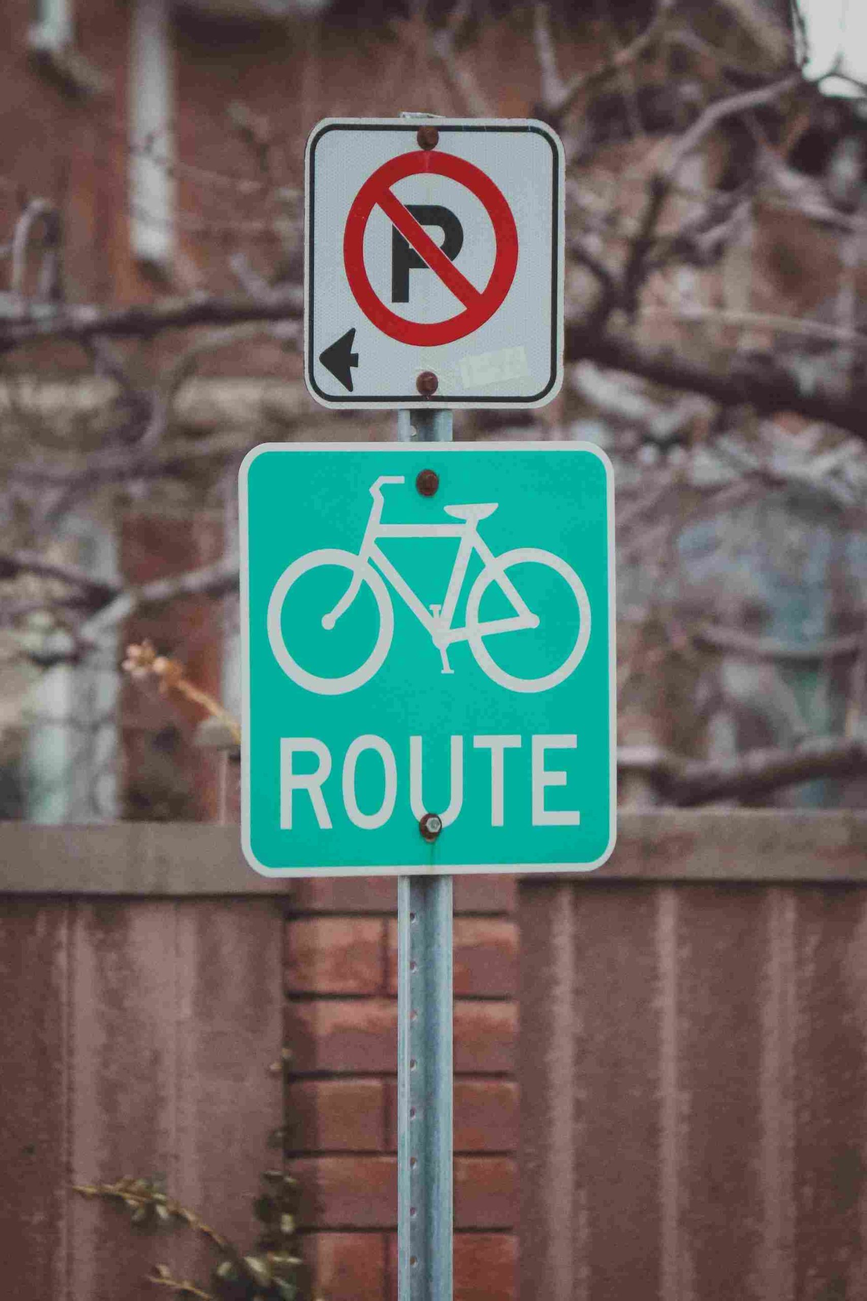 A green bicycle sign post.